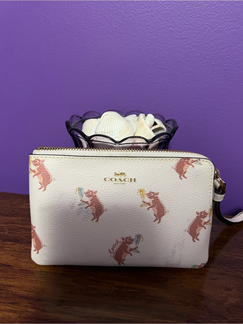 Coach Cream Leather Wristlet with Playful Pig Print